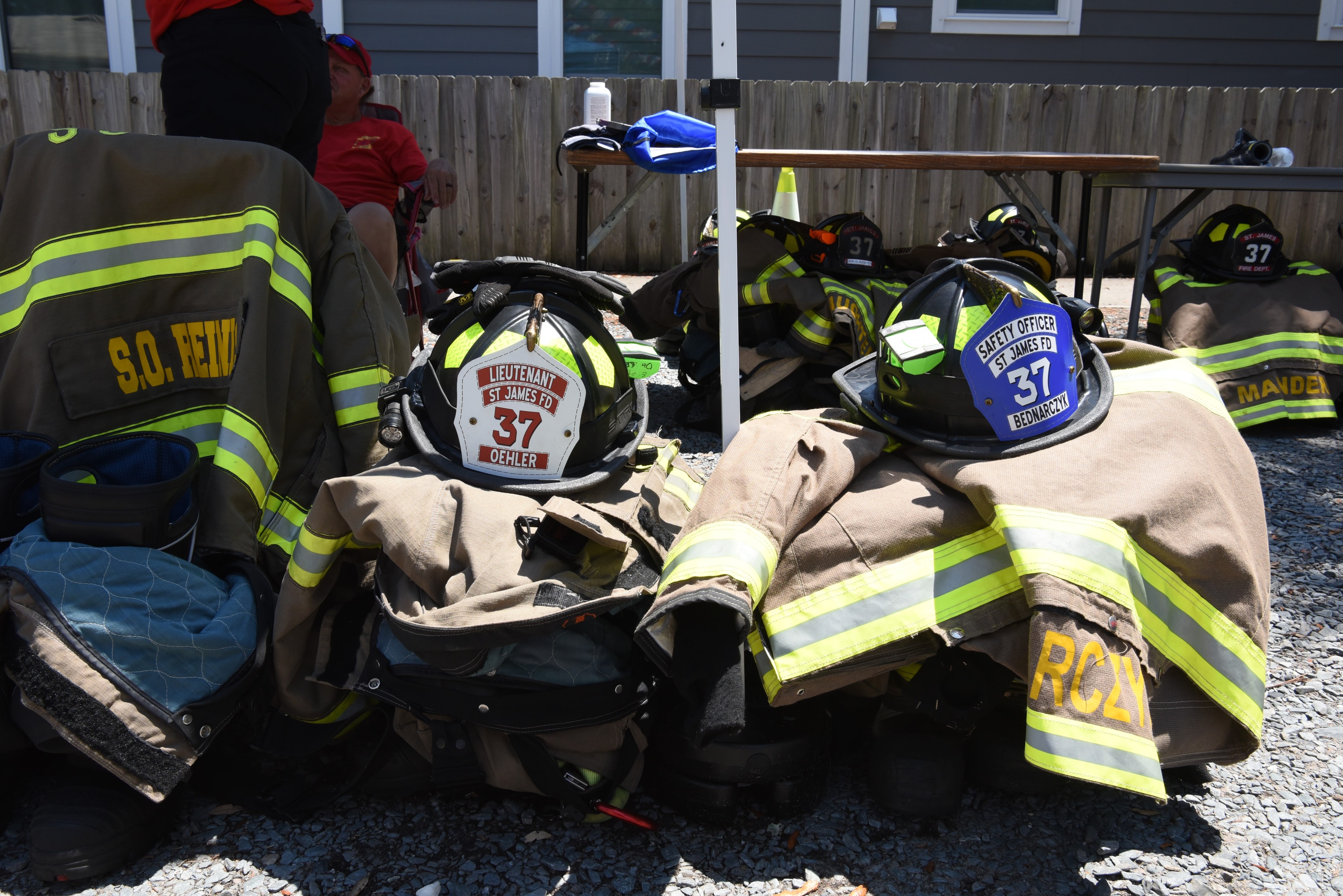 SJFD helmets and turnout gear laid out at the 2026 Southport Firefighter Freedom Competition